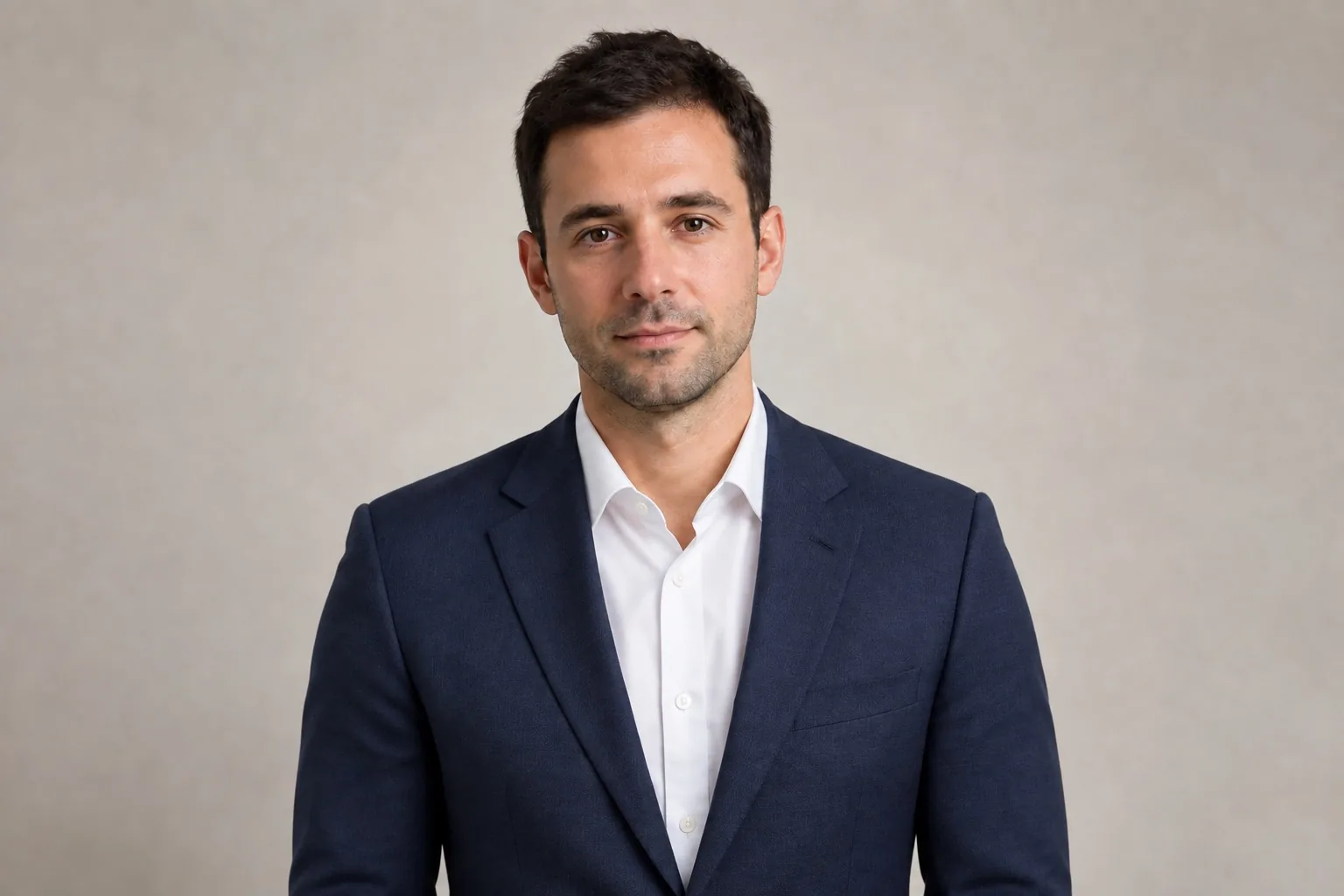 Same man wearing a navy blazer after an AI clothes edit
