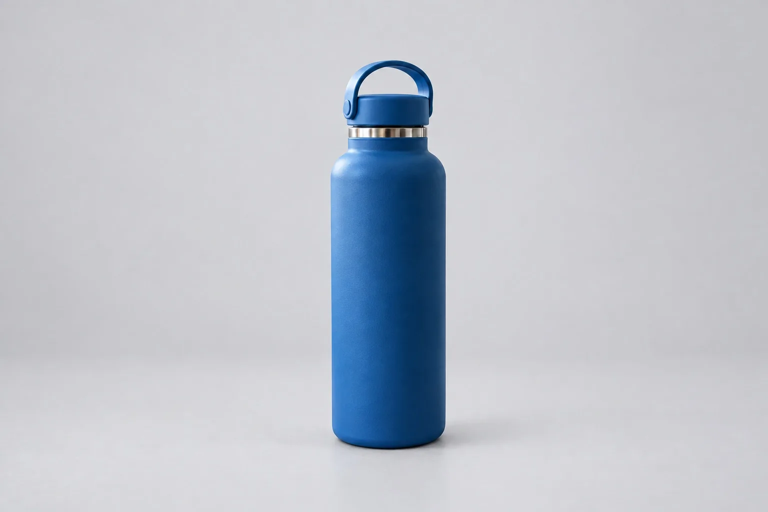 Blue water bottle on a clean studio background after AI photo editing